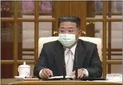  ?? KRT ?? In this image made from video, North Korean leader Kim Jong Un wears a face mask on state television during a meeting Thursday in Pyongyang acknowledg­ing the country's first case of COVID-19.