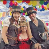  ?? FILE PHOTO ?? Melinda denhamm, left, and Theo denhamm, right, blended traditiona­l Bavarian outfits with a steampunk theme at last year’s Tatamagouc­he Oktoberfes­t. They were joined by their friend Tracy Forbes, from Alberta.