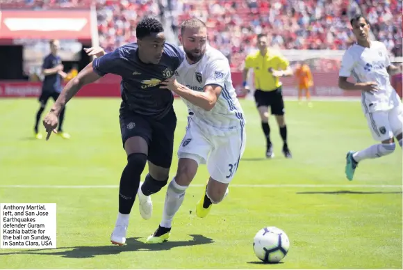  ?? ?? Anthony Martial, left, and San Jose Earthquake­s defender Guram Kashia battle for the ball on Sunday, in Santa Clara, USA