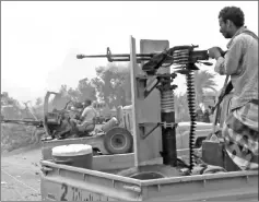  ??  ?? A file image grab shows Yemeni pro-government forces firing a heavy machine gun at the south of Hodeida airport, in Yemen’s Hodeida province. — AFP photo