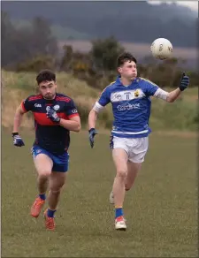  ??  ?? Coláiste Bhríde Carnew’s Daniel Hedderman races away from Coláiste Chill Mhantáin’s Malachy Stone during the Schools ‘A’ semi-final.