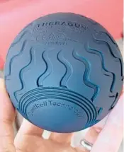  ?? DAVID CARNOY/CNET ?? Theragun Wave Solo vibrating massage ball charges with a USB-C cable and has three vibration speed options.