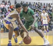  ?? PHOTO BY WALLACE BARRON ?? Thomas Stone’s Gary Grant and Shiloh Beale of St. Charles battles for a loose ball in Wednesday night’s SMAC Potomac Division boys basketball contest. Grant scored 21 points as Stone edged St. Charles, 52-51.