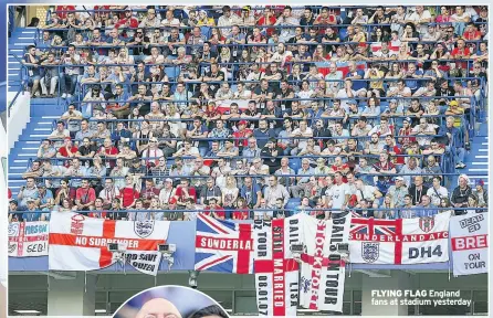  ??  ?? FLYING FLAG England fans at stadium yesterday