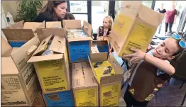  ?? Dan Watson/ The Signal ?? Seven- and eight-year-old Girl Scouts from Troop 132 in Saugus unload some of the 550 boxes of Girl Scout cookies they donated to the Santa Clarita Valley Senior Center at Bella Vida Meals on Wheels program in Santa Clarita.