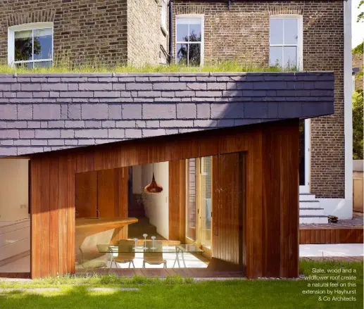  ??  ?? Slate, wood and a wildflower roof create a natural feel on this extension by Hayhurst & Co Architects