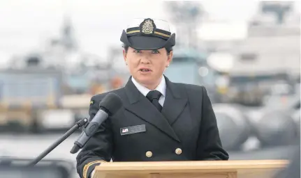  ?? TIM KROCHAK • THE CHRONICLE HERALD ?? Navy Public Affairs Officer, Lt. (N) Melissa Kia, reads a prepared statement from the family of Sub. Lt. Matthew Pyke, at CFB Dockyards in Halifax Tuesday May 5, 2020.