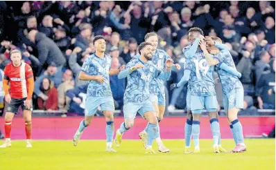  ?? AP ?? Aston Villa’s Lucas Digne (right) is congratula­ted by his teammates after scoring his side’s third goal during an English Premier League football match against Luton Town at Kenilworth Road Stadium in Luton, England on Saturday.