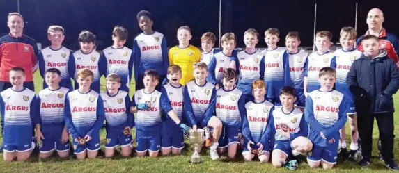  ??  ?? Right: The winning Monastery NS team and captain Adam Gillespie receiving the cup from Fiachra Bell.