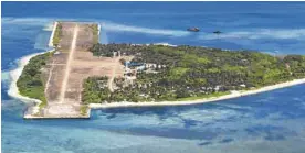  ?? —PHOTO COURTESY OF PAF ?? PAGASA Soldiers and their families live on Pagasa, the biggest island in the Kalayaan Group. The island has an airstrip used by the military in supplying the community.