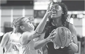  ??  ?? Houston's Jayla Hemingway (right) is a 5-10 guard, who averaged 21.7 points and 7.2 rebounds and shot 49 percent from the floor this past season while leading the Mustangs to a 28-6 record. CAITIE MCMEKIN/NEWS SENTINEL