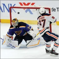  ?? AP PHOTO / BILL BOYCE ?? Edmonton Oilers' Connor McDavid (97) scores the winning goal in the shootout against St. Louis Blues' Jake Allen in an NHL hockey game, Wednesday in St. Louis.