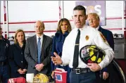  ?? DOUG MILLS / NEW YORK TIMES ?? President Donald Trump and first lady Melania Trump visit a fire station in Manchester, N.H., before he spoke Monday at Manchester Community College. “Other countries don’t play games . ... But the ultimate penalty has to be the death penalty,” he said.