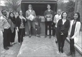  ??  ?? Amy Henderson, left center, and Mira Mendick, Lutheran Social Services donations coordinato­r, right center, joined staff from Lutheran Social Services in March to deliver hundreds of items to be donated to refugees resettling in the Washington D.C. area.