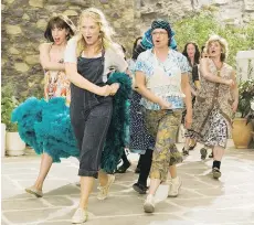  ?? UNIVERSAL ?? Christine Baranski, left, Meryl Streep and Julie Walters lead the way in the 2008 film version of the ABBA musical Mamma Mia! — which proved to be a global success, raking in more than US$600 million.