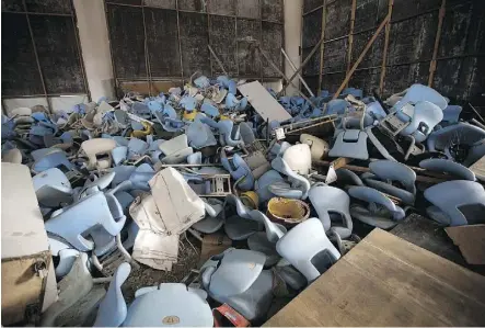  ??  ?? Seats lie jumbled in a pile inside Maracana stadium in Rio de Janeiro. The historic stadium, site of the opening and closing ceremonies, has been vandalized as stadium operators, the Rio state government, and Olympic organizers, have fought over US$1...