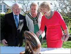  ??  ?? state visit: President Higgins and wife Sabina, right, in Australia