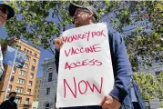  ?? AP ?? A man holds a sign urging increased access to the monkeypox vaccine in San Francisco last month. U.S. health officials on Tuesday authorized a new vaccinatio­n strategy designed to stretch limited supplies.