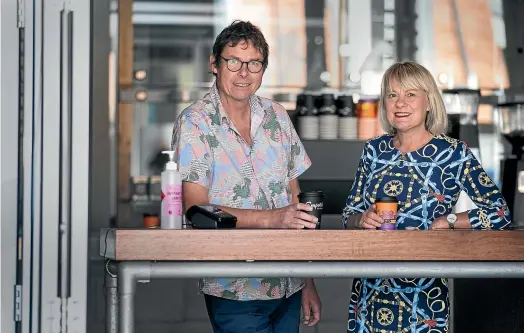  ?? KEVIN STENT/STUFF ?? Owners Eric and Miriam Heycoop at their temporary counter at Emporio Coffee in Wellington, now open for contactles­s takeaway coffee at their shop on Abel Smith St.