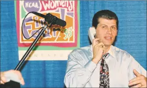  ?? Robert W Stowell Jr / Getty Images ?? UConn coach Geno Auriemma accepts a call from President Bill Clinton after winning the 1995 national championsh­ip.