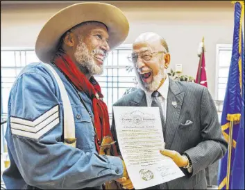  ??  ?? Keith Hill, president trooper of the 9th and 10th Horse Cavalry Associatio­n, with Fred Wagar, deputy director for the Nevada Department of Veteran Services.