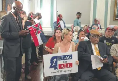  ??  ?? Supporters and opponents of the Mississipp­i flag fill Biloxi City Council chambers last month as council members debated whether to pass a resolution requiring that the flag fly at city buildings. Mary Perez, The Sun Herald