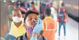  ?? SATISH BATE/HT PHOTO ?? A healthcare worker collects swab samples of passengers at Lokmanya Tilak Terminus, on Friday.