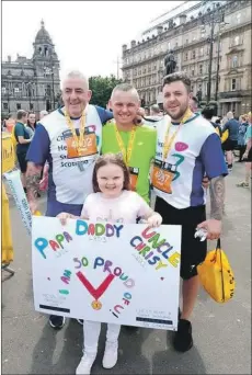  ??  ?? Chris, left, with sonin-law Paul O’Neil, son Christophe­r, right, and granddaugh­ter Layla at the Glasgow 10k in June.