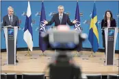  ?? OLIVIER MATTHYS — THE ASSOCIATED PRESS ?? NATO Secretary General Jens Stoltenber­g, center, participat­es in a media conference with Finland’s Foreign Minister Pekka Haavisto, left, and Sweden’s Foreign Minister Ann Linde, right, at NATO headquarte­rs in Brussels.