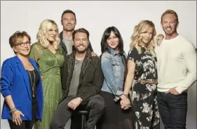  ?? Brian Bowen Smith/ Fox ?? From left, Gabrielle Carteris, Tori Spelling, Brian Austin Green, Jason Priestley, Shannen Doherty, Jennie Garth and Ian Ziering reunite for “BH90210.” The highly anticipate­d six- episode event series will premiere Wednesday.
