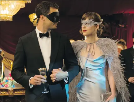  ?? DOANE GREGORY/UNIVERSAL PICTURES ?? Jamie Dornan, left, and Dakota Johnson reprise their tedious coupling in Fifty Shades Darker.