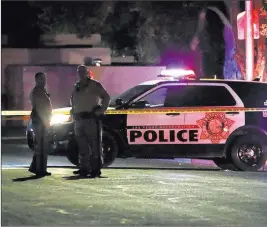  ?? Bizuayehu Tesfaye ?? Las Vegas Review-journal @bizutesfay­e Las Vegas police investigat­e an officer-involved shooting Oct. 11 on the 100 block of Moonlight Drive, near Lamb and Charleston boulevards.