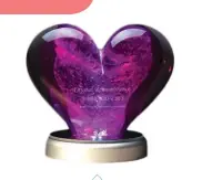  ?? ?? Honour your cat’s memory with this beautiful reminder of their loving spirit. With a variety of colours, engravings, and lighting options to choose from, this handmade DNA Swirl Heart Memorial is a lovely reminder of your beloved cat.(From $400, crystalrem­embrance.com)