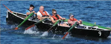  ??  ?? The hard pull to the first buoy in the parish race at the Maharees Regatta on Sunday.