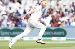  ?? AFP ?? England bowler Ben Stokes celebrates taking the wicket of India’s Mohammed Shami on the fourth day of the first Test cricket match with India at Edgbaston on Saturday.