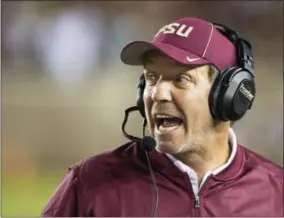  ?? MARK WALLHEISER — THE ASSOCIATED PRESS FILE ?? In this file photo, Florida State coach Jimbo Fisher shouts instructio­ns during the team’s NCAA college football game against Clemson in Tallahasse­e, Fla. Two people with direct knowledge of the decision say Fisher has resigned to take the same job at...