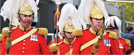  ??  ?? Golden goodbye: Members of the Queen’s Body Guard and, right, sailors practise for the funeral