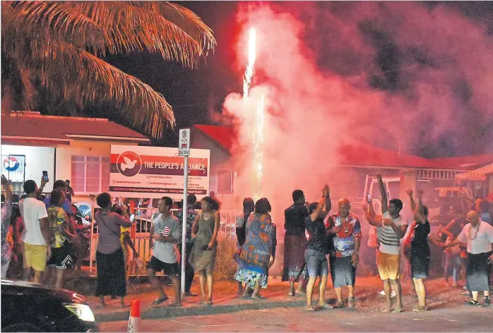  ?? Picture:ATU RASEA ?? Youth members of the PAP celebrate at the head office last night in Suva.