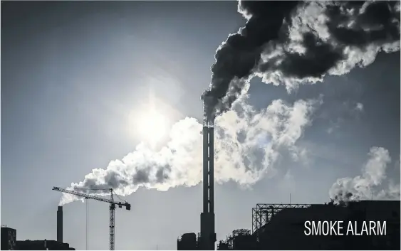  ?? Picture: AFP ?? Smoke rises from the chimneys of a waste incinerati­on plant in Saint-Ouen on the outskirts of the French capital Paris, yesterday.