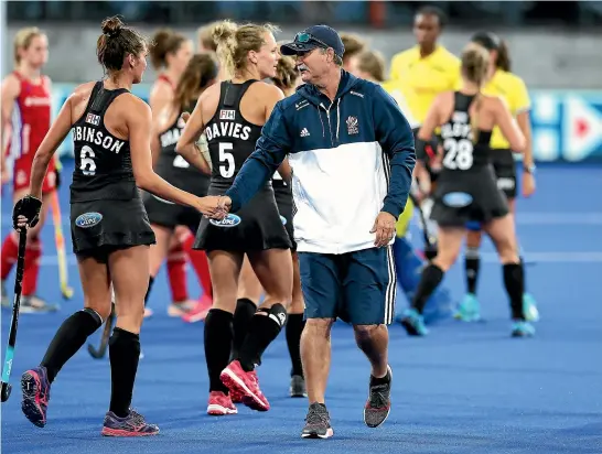  ?? GETTY IMAGES ?? Former Black Sticks coach Mark Hager congratula­tes Amy Robinson after New Zealand beat the Hager-coached Great Britain 5-1 in Christchur­ch last night.