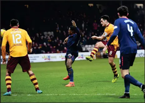  ??  ?? Motherwell’s Carl McHugh scores a thunderbol­t from outside the area to seal the Steelmen’s passage to the last four of the Scottish Cup