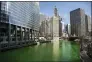  ?? PAT NABONG — CHICAGO SUN-TIMES VIA AP ?? The Chicago River was dyed green ahead of St. Patrick’s Day March 13 in Chicago.