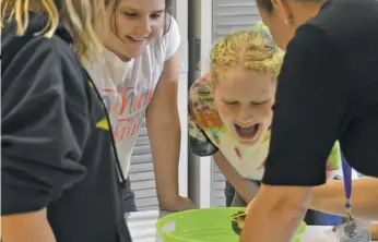  ?? BY HOLLY JENKINS ?? A group of RCES students tackles an experiment in the school’s new STEAM lab.