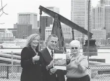  ?? DAN JANISSE ?? The Rotary Club of Windsor’s (1918) Maureen Lucas, left, Lou Valente and Janet Kelly hold an artist’s rendering Tuesday showing the Rotary Centennial Plaza to be built along the downtown waterfront. The $395,000 project is to be completed by May 2018.