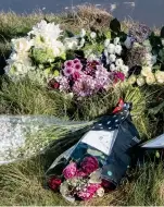  ?? ?? Respects: Flowers have been laid in tribute to the teenagers at the site of the fatal crash