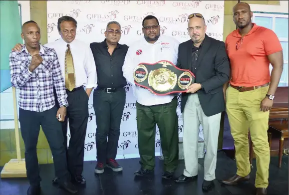  ??  ?? Organisers of the ‘Locked and Loaded’ card along with boxer, Dexter Marques pose for a photo following yesterday’s press briefing at Giftland Mall. In the photo along with Marques (extreme left) are GBBC President, Peter Abdool, Roy Beepat (President...