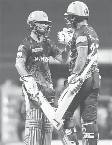  ?? (Photo courtesy IPL website) ?? Nitish Rana and Rinku Singh celebrate KKR’s seven wicket win.