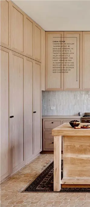  ??  ?? CABINETRY, IN NAVLAM ‘SANDBLASTE­D’ BY NEW AGE VENEERS, IS DRESSED UP WITH A TWENTY2 GRASSCLOTH INLAY FROM STYLE REVOLUTION­ARY. THE LIGHT TONES BLEND IN HARMONY WITH THE RECYCLED OAK ISLAND, DESIGNED BY GEORGIA AND HANDMADE BY HER CARPENTER. CABIN FEVER