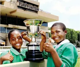  ?? Picture: Yolanda van der Stoep ?? TROPHY HUNT. During a visit to Turffontei­n Racecourse last week, Hlabisile Bhembe (13) and Lesego Tshabalala (11) from Welamlambo Primary School After Care Centre in Tembisa, got their hands on the trophy that will be up for grabs in this year's Peermont Emperors Palace Charity Mile at Turffontei­n on Saturday 2 November. Welamlambo Primary School After Care Centre is one of the beneficiar­ies of the event which will see 16 charities affiliated to 16 celebritie­s and 16 top-class racehorses with the worthy causes taking home a share of R1-million.