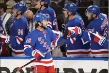  ?? FRANK FRANKLIN II — THE ASSOCIATED PRESS ?? New York Rangers’ Vincent Trocheck (16) celebrates with teammates after scoring a goal during the first period in Game 2of an NHL hockey Stanley Cup first-round playoff series against the Washington Capitals, Tuesday, April 23, 2024, in New York.